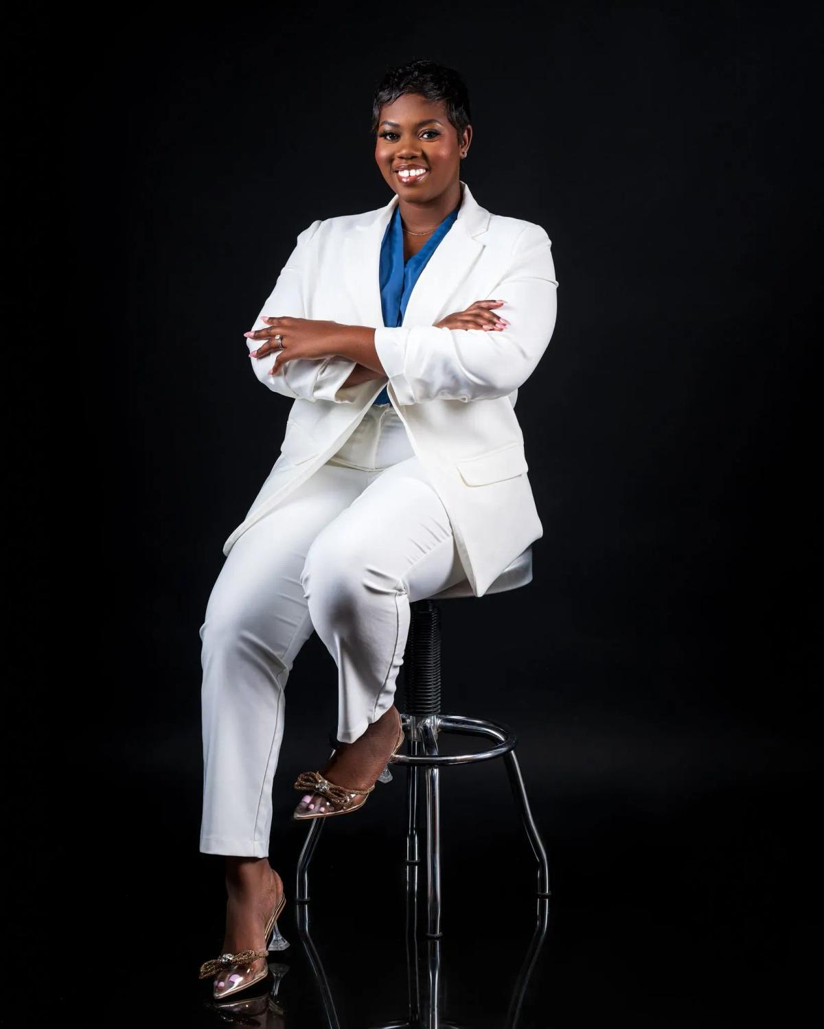 Doctor Cherish Holdipp Sitting in a chair